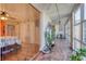 Sunroom features hardwood floors, bead curtains, and abundant natural light at 1224 S Peninsula Dr # 511, Daytona Beach, FL 32118