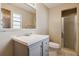 Bathroom with a modern vanity, a large mirror, toilet, and a glass-enclosed shower at 1240 W Voorhis Ave, Deland, FL 32720