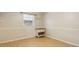 Bright bedroom featuring hardwood floors, neutral walls, and a window with natural light at 1240 W Voorhis Ave, Deland, FL 32720