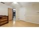 Cozy bedroom boasts hardwood floors, ample closet space, and neutral-colored walls at 1240 W Voorhis Ave, Deland, FL 32720