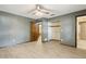 Bedroom features closet, wood floors, ceiling fan, and bathroom access at 1240 W Voorhis Ave, Deland, FL 32720