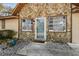 Charming stone home featuring a tidy front yard and decorative gravel at 1240 W Voorhis Ave, Deland, FL 32720