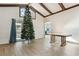 Bright living room featuring wood-look tile floors, and a glimpse into the updated kitchen at 1240 W Voorhis Ave, Deland, FL 32720