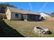 Backyard with fire pit and patio at 1387 Hensley Dr, Deland, FL 32724