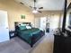Bright bedroom featuring a king-size bed and ensuite bathroom at 1387 Hensley Dr, Deland, FL 32724