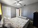 Bright bedroom with full-size bed and ceiling fan at 1387 Hensley Dr, Deland, FL 32724
