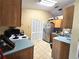 Kitchen with wood cabinets, stainless steel appliances, and light blue countertops at 1387 Hensley Dr, Deland, FL 32724