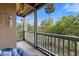 Inviting screened balcony with calming nature views and comfortable seating for relaxation at 1401 S Palmetto Ave # 614, Daytona Beach, FL 32114
