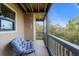 Cozy screened in balcony featuring a chair to relax and enjoy the scenic views at 1401 S Palmetto Ave # 614, Daytona Beach, FL 32114