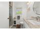 Clean bathroom with a walk-in shower, granite countertop, and modern fixtures at 1401 S Palmetto Ave # 614, Daytona Beach, FL 32114