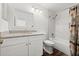 Modern bathroom with white vanity, granite countertop, shower with marble tile at 1401 S Palmetto Ave # 614, Daytona Beach, FL 32114