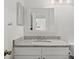 Bright bathroom featuring granite countertops, white cabinets, and modern fixtures, blending functionality with style at 1401 S Palmetto Ave # 614, Daytona Beach, FL 32114