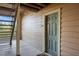 A condo unit entry with exterior stairs is shown, revealing a neatly painted front door and neutral siding at 1401 S Palmetto Ave # 614, Daytona Beach, FL 32114
