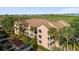 Multi-story condo building with well-maintained facade, lush landscaping, and ample parking, offering comfortable living at 1401 S Palmetto Ave # 614, Daytona Beach, FL 32114