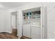 Convenient laundry closet featuring a washer and dryer and plenty of storage space at 1401 S Palmetto Ave # 614, Daytona Beach, FL 32114
