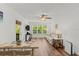 Bright, open-concept living space features sleek floors, a ceiling fan, and stylish decor at 1401 S Palmetto Ave # 614, Daytona Beach, FL 32114