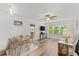 Well-lit open-concept living space with sleek floors and a view to the outdoor patio at 1401 S Palmetto Ave # 614, Daytona Beach, FL 32114