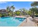 Resort-style pool offers a refreshing oasis with ample seating and lush landscaping for relaxation and enjoyment at 1401 S Palmetto Ave # 614, Daytona Beach, FL 32114