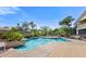 Resort-style community pool with inviting lounge chairs and lush landscaping, perfect for relaxation and recreation at 1401 S Palmetto Ave # 614, Daytona Beach, FL 32114