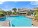 Inviting community pool and lounge area with palm trees and cozy seating at 1401 S Palmetto Ave # 614, Daytona Beach, FL 32114