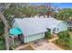 Housetop view showing home's roofline and landscaping at 1412 Oak Forest Dr, Ormond Beach, FL 32174