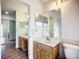 Main bathroom with double vanity and updated fixtures at 1412 Oak Forest Dr, Ormond Beach, FL 32174