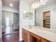 Bright bathroom with double vanity and mirrored medicine cabinets at 1412 Oak Forest Dr, Ormond Beach, FL 32174
