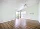 Bedroom featuring sliding glass doors and a ceiling fan at 1412 Oak Forest Dr, Ormond Beach, FL 32174