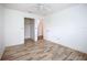 Bright bedroom with wood-look floors and a large closet at 1412 Oak Forest Dr, Ormond Beach, FL 32174