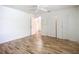Bedroom with wood-look floors and large closet at 1412 Oak Forest Dr, Ormond Beach, FL 32174