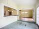 Sunlit dining area with tile flooring and access to the living room at 1412 Oak Forest Dr, Ormond Beach, FL 32174