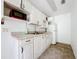 Small kitchen featuring white cabinets and red microwave at 1412 Oak Forest Dr, Ormond Beach, FL 32174