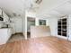 Simple kitchen with white cabinets and laminate flooring at 1412 Oak Forest Dr, Ormond Beach, FL 32174