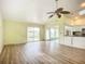 Spacious living room with vaulted ceilings and sliding glass doors at 1412 Oak Forest Dr, Ormond Beach, FL 32174