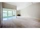 Bright living room with sunroom and a mid-century modern fireplace at 1412 Oak Forest Dr, Ormond Beach, FL 32174