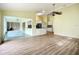 Open living room with views into the kitchen and dining areas at 1412 Oak Forest Dr, Ormond Beach, FL 32174