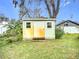 Small metal storage shed in the backyard at 1412 Oak Forest Dr, Ormond Beach, FL 32174