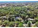 Aerial view of houses surrounded by lush trees at 1450 Alden St, Deland, FL 32720