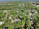 Aerial view of a house nestled in a wooded area at 1450 Alden St, Deland, FL 32720