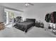 Main bedroom with large window, ceiling fan, and walk-in closet at 1450 Alden St, Deland, FL 32720