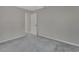 Small bedroom with carpeted floors and a door to hallway at 1450 Alden St, Deland, FL 32720