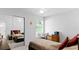 Bright bedroom with mirrored closet and window at 1450 Alden St, Deland, FL 32720