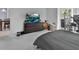Bedroom with large TV, dresser, and window view at 1450 Alden St, Deland, FL 32720