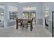 Small dining area with table and chairs, adjacent to kitchen and screened porch at 1450 Alden St, Deland, FL 32720
