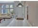 Entryway with tile floors, a white door, and a large window at 1450 Alden St, Deland, FL 32720
