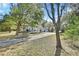 Single story house with long driveway and trees at 1450 Alden St, Deland, FL 32720