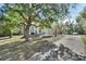 Single-story house with driveway and large trees at 1450 Alden St, Deland, FL 32720