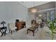 Living room features hardwood floors, a large window, and a built-in cabinet at 1450 Alden St, Deland, FL 32720