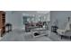 Living room with grey walls, a comfortable sofa, and access to a sunroom at 1450 Alden St, Deland, FL 32720
