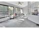 Relaxing screened porch with hammock and ceiling fan at 1450 Alden St, Deland, FL 32720
